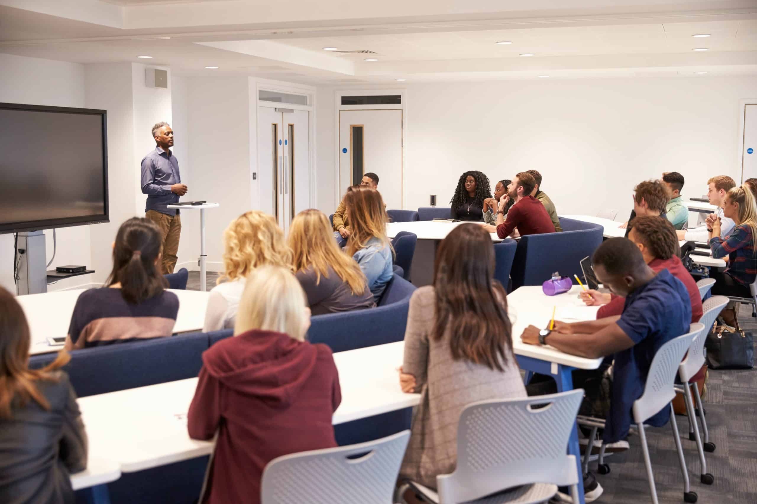 Tru-Connect delivers hybrid classroom AV integration for a leading business school, connecting in-person and remote learning.