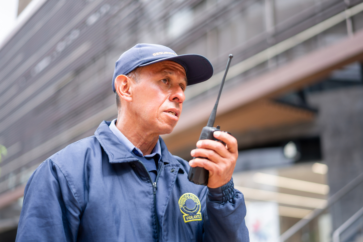 Public safety professional using a two-way radio for emergency communications